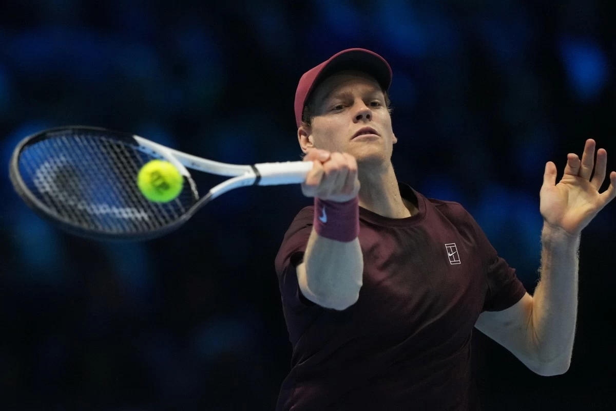 Italy's Jannik Sinner returns the ball to Germany's Alexander Zverev during their tennis match of the ATP World Tour Finals, in Turin, Italy, Wednesday, Nov. 12, 2025. (AP Photo/Antonio Calanni)