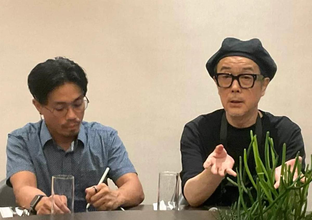 Japanese actor Lily Franky (right) answers questions from the media through an interpreter during a press conference in Quezon City.