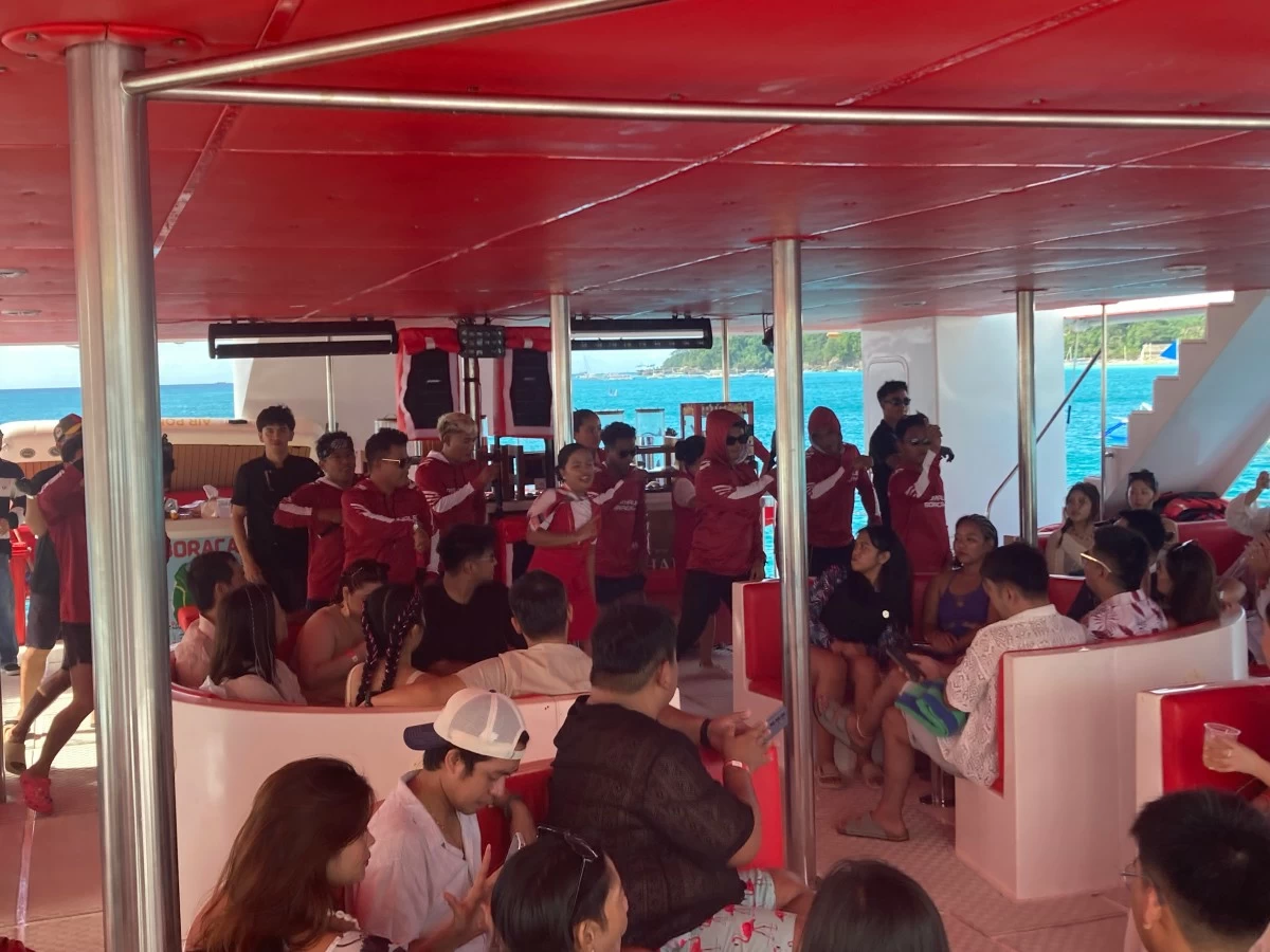 CAN'T STOP PARTY ROCKING Staff give their all in ensuring everyone has a grand time aboard the party yacht.