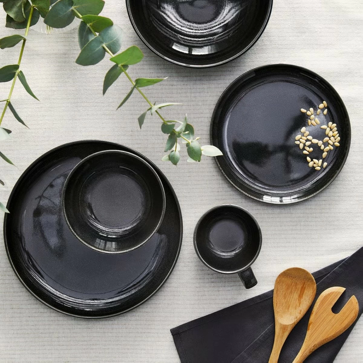 The dark gray Gladelig plate, priced at ₱199, has a natural stone look, great for a clean, modern table.