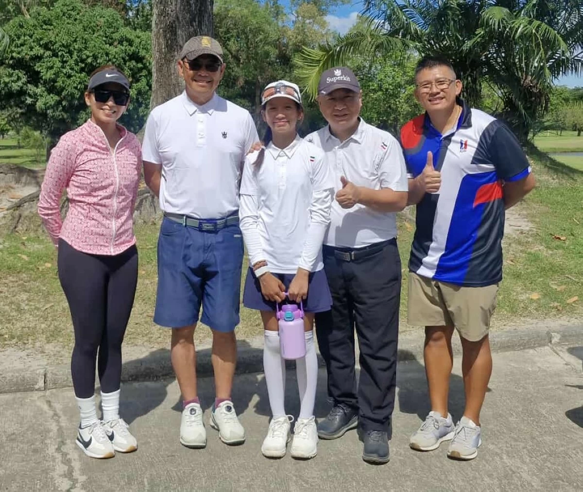 Superkit Tour executives Stanley loo, second from left, and Johnny Wang (CEO), second from right, with previous leg winner Brie Macasaet and her parents, Junior Golf Foundation of the Philippines corporate secretary Mariel Macasaet and Brian Macasaet. (JGFP Photo)