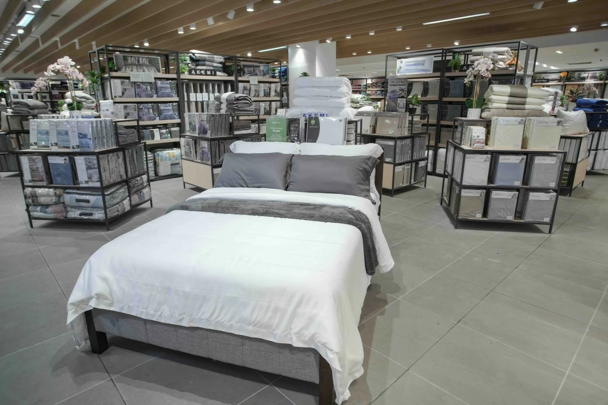 REST READY A bed with coordinated beddings creates a calm, inviting setup for the home.