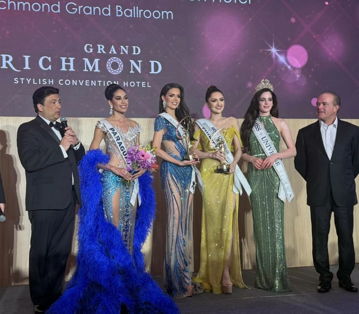Miss Universe 2025 third runner-up Ahtisa Manalo takes third place in the Beyond The Crown program. Also in the photo are  (from left): Miss Universe CEO Mario Bucaro, Miss Paraguay Yanina Gomez (first place), Miss Netherlands Nathalie Mogbelzada (second place), Miss Universe 2025 Fatima Bosch, and Miss Universe Organization owner Raul Rocha Cantu.