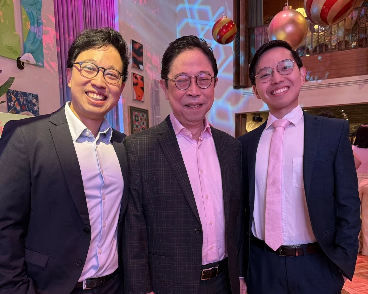 George Siy with two of his three sons.