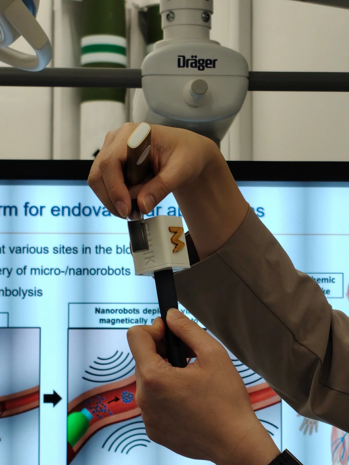 Nanobots inside the glass container as presented by Professor Tony Chan at the Multi-Scale Medical Robotics Center in Hong Kong.