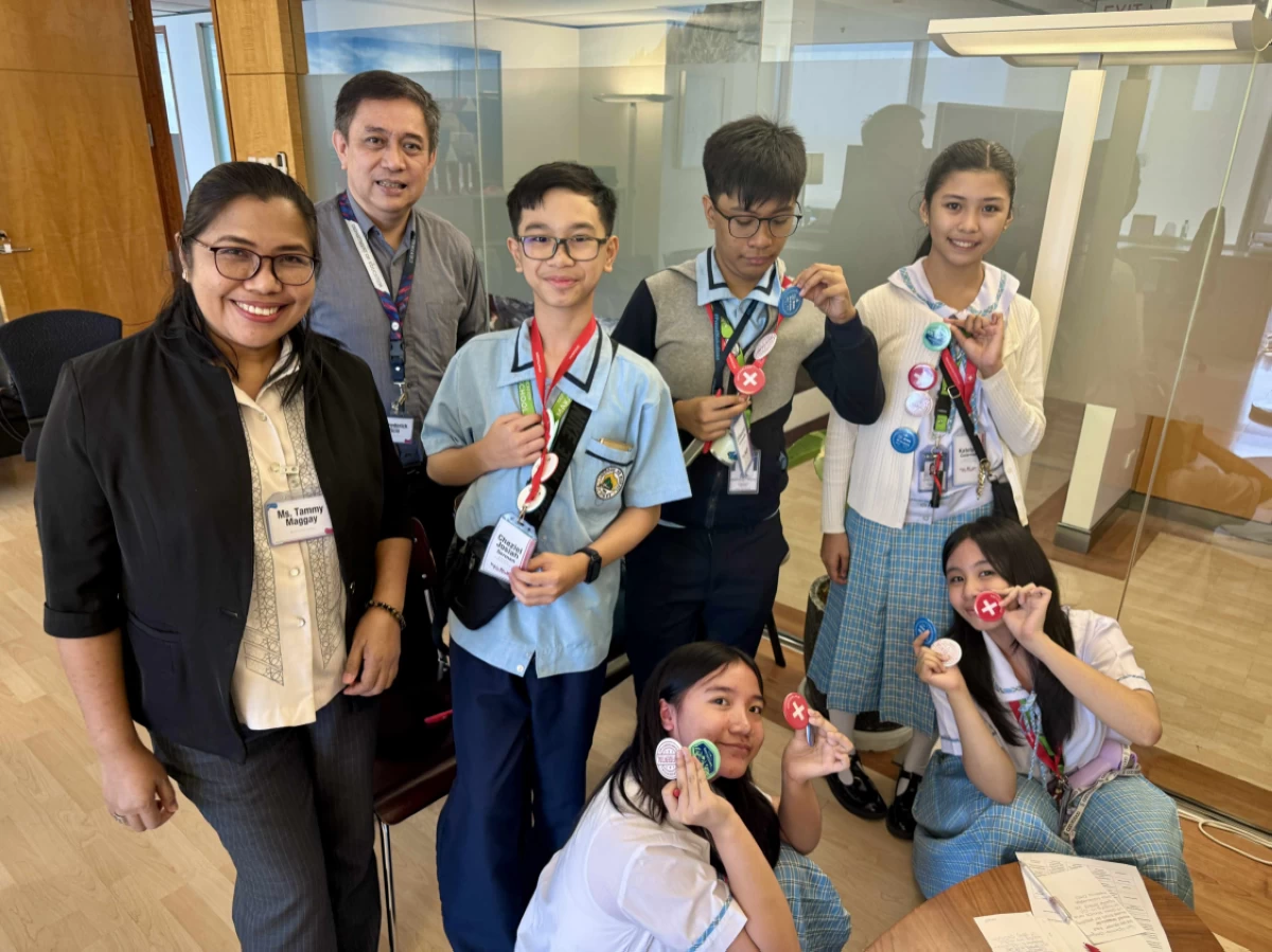 DepEd representative Frederick Orticio with Makati High School students
