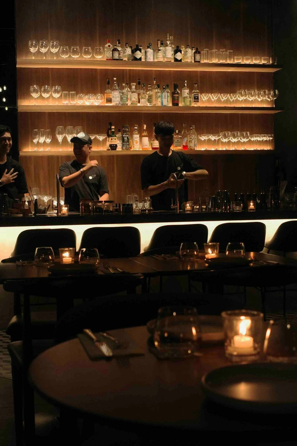 EVENING SETTLE Interiors at Three Dots, dim-lit and warm in tone, a space made for unhurried nights where conversation lingers with the second round.