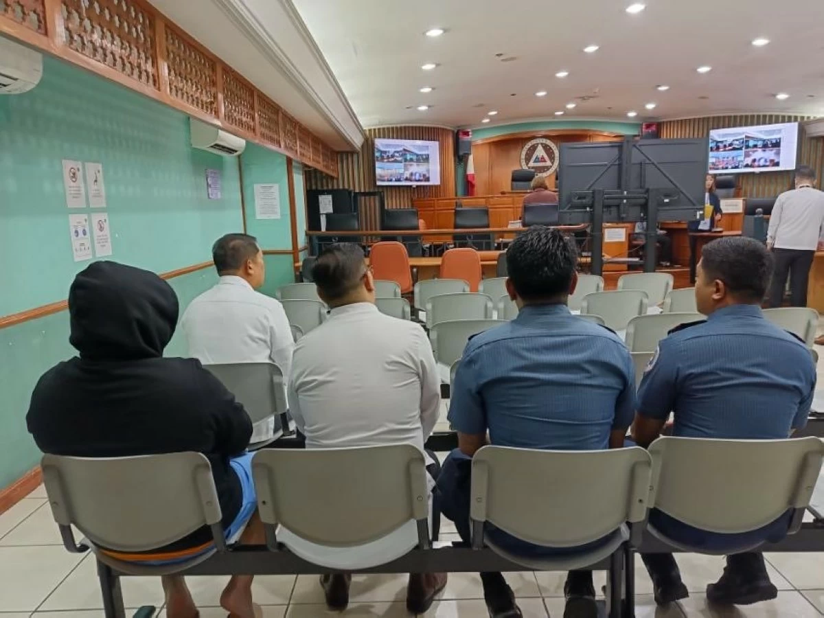 CIDG operatives prepare to present DPWH-Mimaropa Planning and Design head Montrexis Tamayo (wearing black jacket) at the Sandiganbayan on Wednesday, Nov. 26, 2025, or a day after his arrest at NAIA Terminal 3. (photo: PNP)