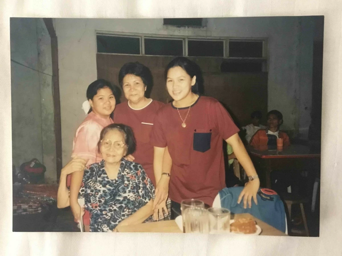 Treena with her two grandmothers, Mama Minda on her maternal side and Lola Nydia on her paternal side, joined by her sister Trixie.