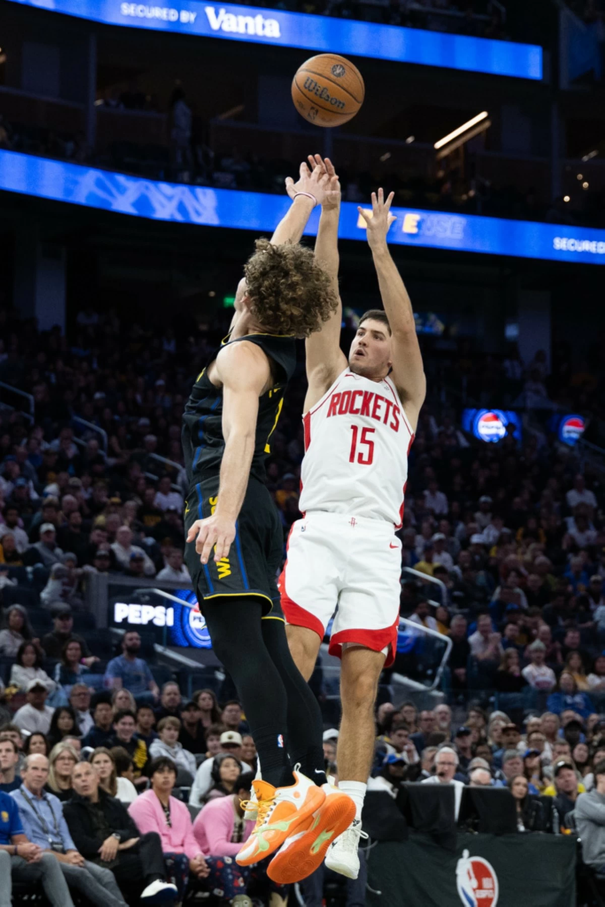 Houston Rockets guard Reed Sheppard shoots past Golden State Warriors guard Brandin Podziemski during the second half of an Emirates NBA Cup basketball game Wednesday, Nov. 26, 2025, in San Francisco. (AP Photo/Benjamin Fanjoy)