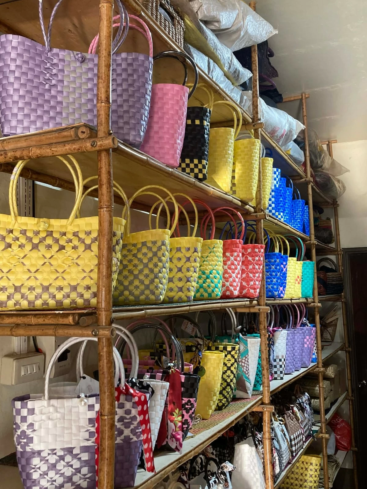 RESPECT THE CRAFT Handwoven bags come in vibrant colors.