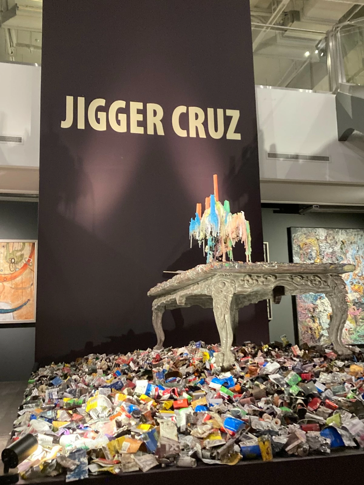 THOUSANDS OF TUBES Curator Norman Crisologo jokes that other artists get angry at Jigger for using up a lot of oil paint.