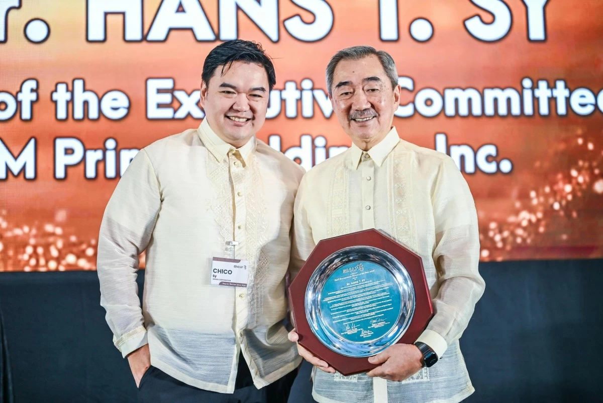 Hans “Chino” Sy Jr. (left) stands proudly by his father, Hans Sy (right), during the MAP 2025 ‘Management Person of the Year’ awarding.