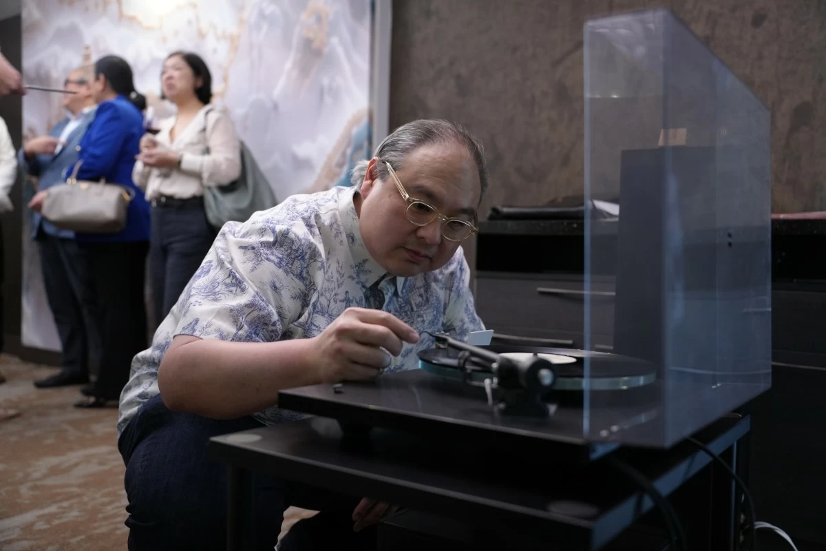 Jacinto Ng, Jr. playing his personal music collection on a limited edition Rega Planar 3 turntable