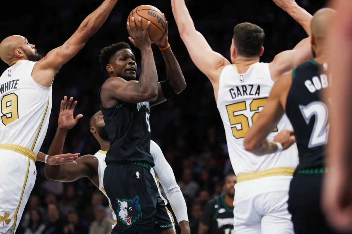 Minnesota Timberwolves' Anthony Edwards (5) possesses the ball during a game against the Boston Celtics during the first half of an NBA basketball game, Saturday, Nov. 29, 2025, in Minneapolis. (AP Photo/Lily Dozier)