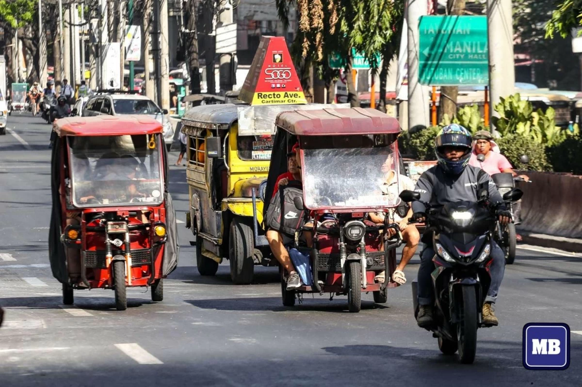  E-bikes, e-trikes, and tricycles are seen passing by along Recto Avenue in Manila on Saturday, April 13. (MB file photo)