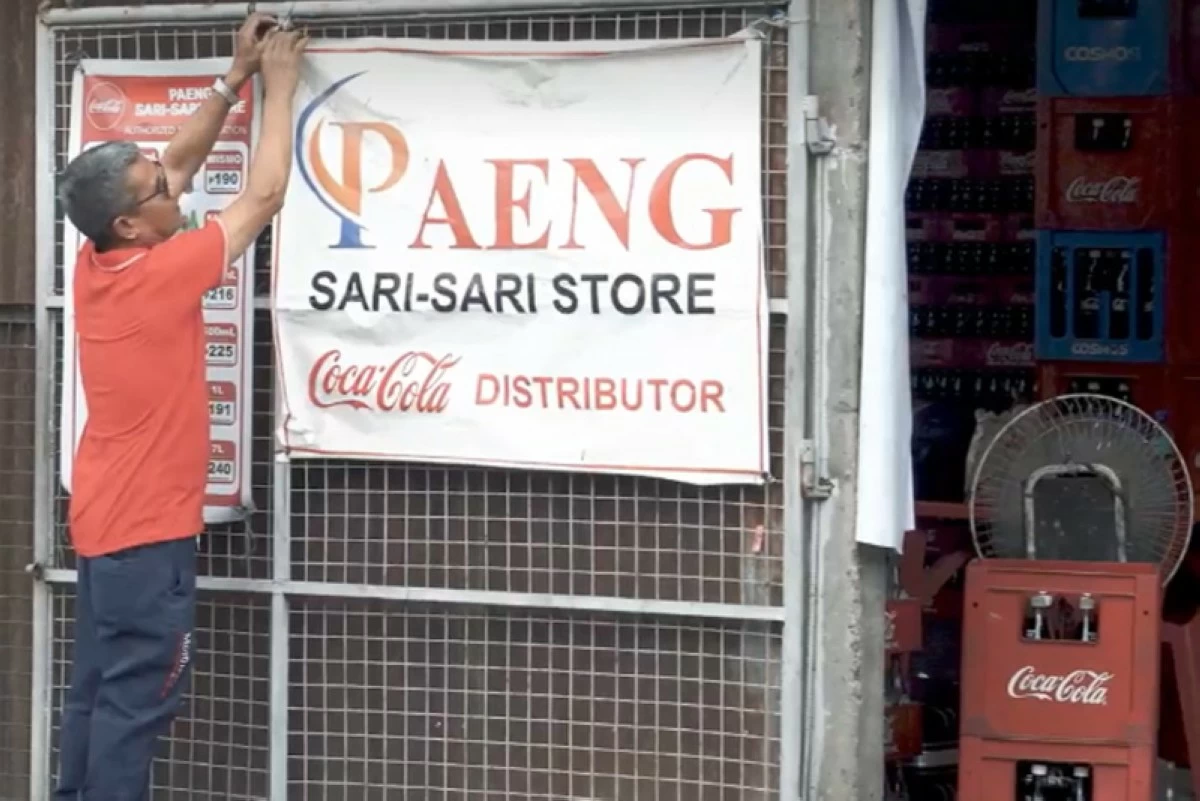 Ronie Alcazar, owner of Paeng Store, prepares his dealership hub for a busy day of inventories and deliveries.