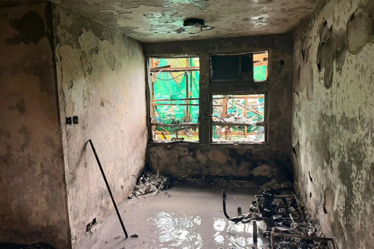 In this photo released by Hong Kong Police Public Relations Branch, the view of a burnt out apartment is seen in the aftermath of a deadly Wednesday fire at Wang Fuk Court, a residential estate in the Tai Po district of Hong Kong's New Territorie Sunday, Nov. 30, 2025. (Hong Kong Police Public Relations Branch via AP)