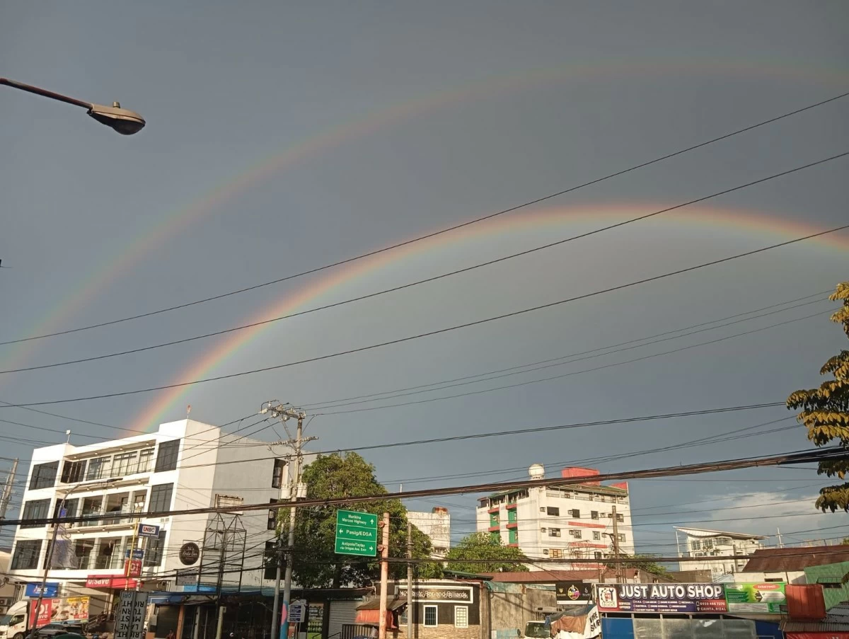 Two rainbow arches appear shortly after the rain shower on Nov. 30 as shown in this photo taken by this reporter in Cainta, Rizal.