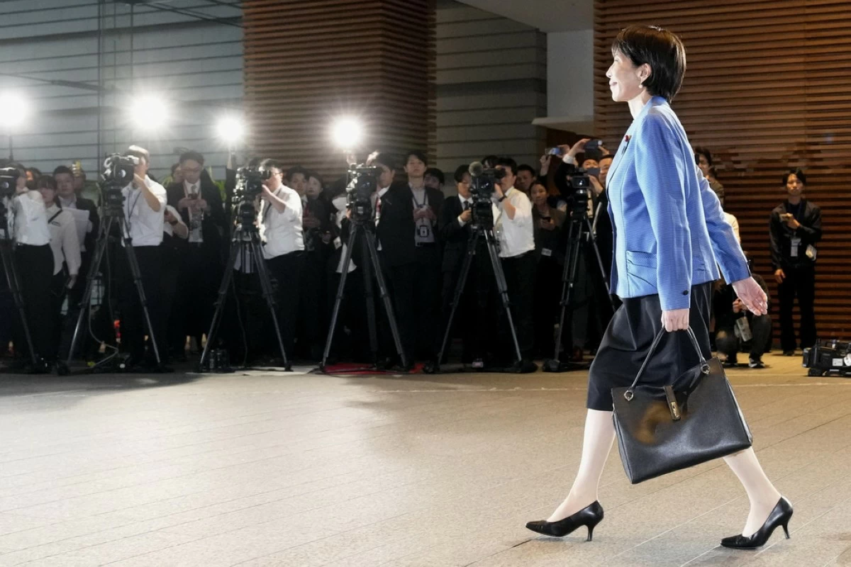 Japanese Prime Minister Sanae Takaichi arrives at the prime minister's office in Tokyo on Oct. 21, 2025. (Kyodo News via AP)