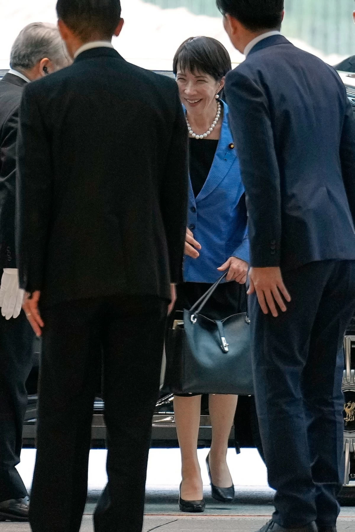 Japan's Prime Minister Sanae Takaichi arrives at the prime minister's office on Oct. 21, 2025, in Tokyo. (AP Photo/Eugene Hoshiko)