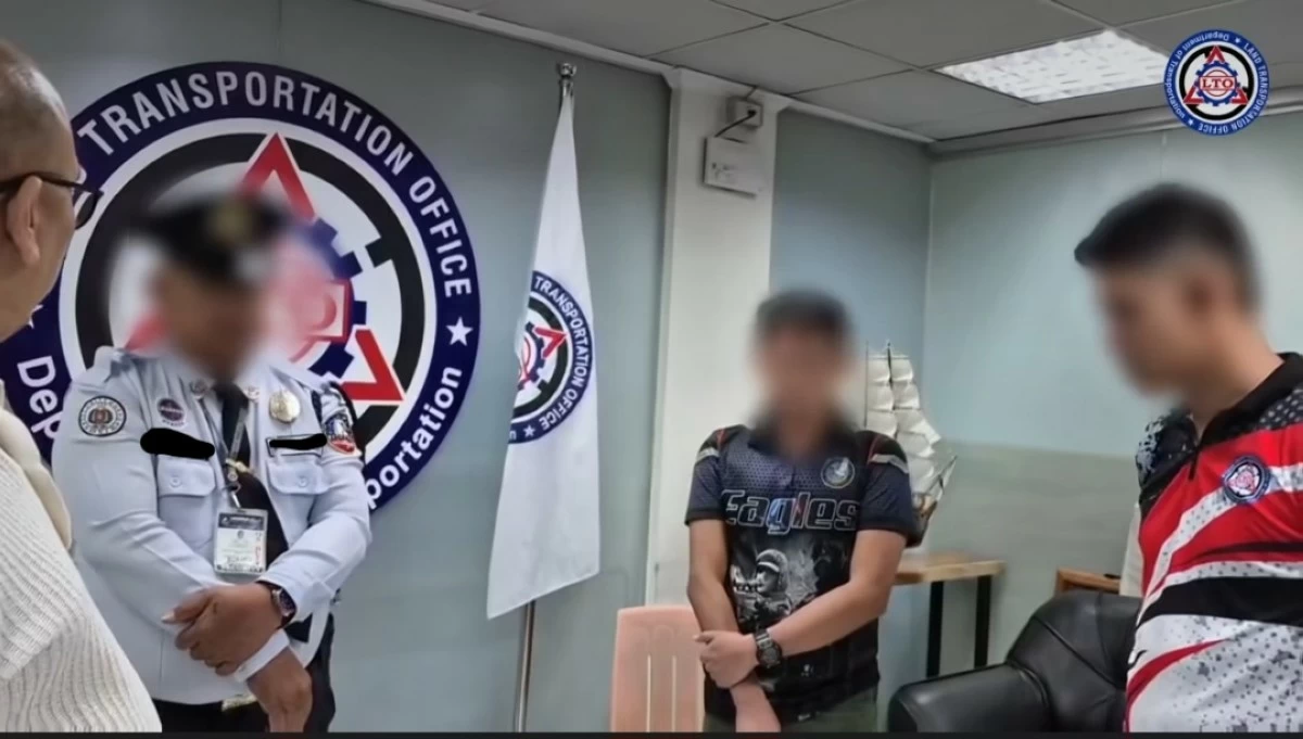 LTO chief Asst. Secretary Markus Lacanilao confronts the two agency employees and a security guard for allegedly extorting money from jeepney operators and drivers. (photo: LTO) 