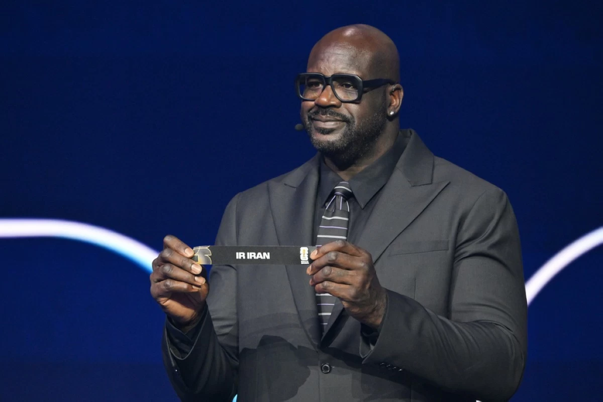 Former NBA player Shaquille O'Neal holds up Iran after drawing from a pot during the draw for the 2026 soccer World Cup at the Kennedy Center in Washington, Friday, Dec. 5, 2025. (Mandel Ngan/Pool Photo via AP)