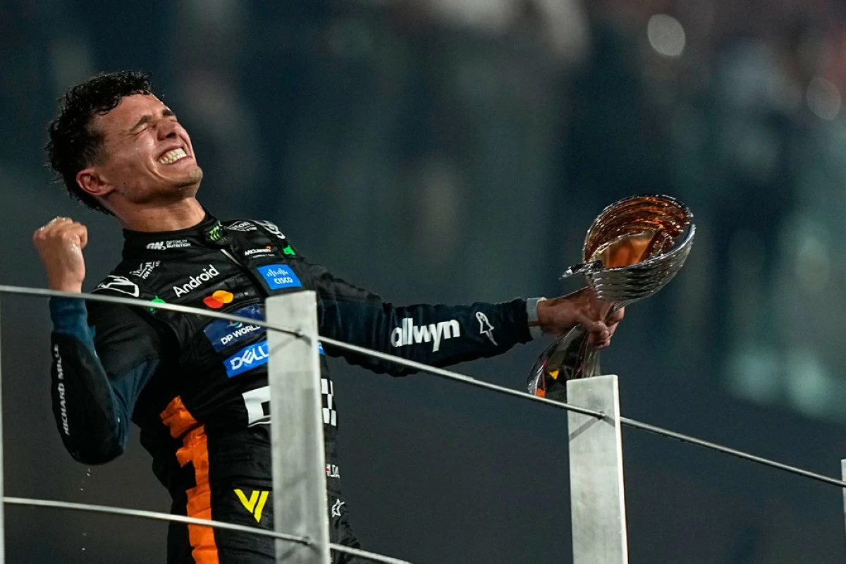 McLaren driver Lando Norris of Britain celebrates after becoming a world champion after the Formula One Abu Dhabi Grand Prix at the Yas Marina Circuit in Abu Dhabi, UAE, Sunday, Dec. 7, 2025. (AP Photo/Fatima Shbair)