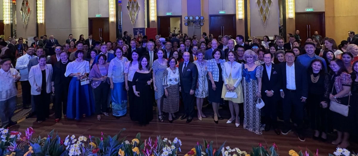 Distinguished guests and cherished friends of the embassy create an atmosphere of warmth and celebration in the grand ballroom.