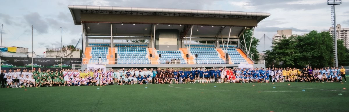 Players from 18 participating teams of the Sixth First Balfour Football Cup gather at the McKinley Hill Stadium in Taguig City for a group photo.