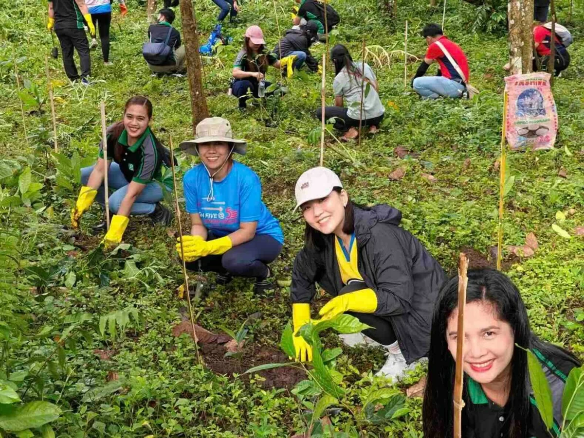 Jollibee Group employees join hands at the LLDA Tree Planting Activity in Sto. Tomas, Batangas, contributing 560 volunteer hours to help nurture a greener future.