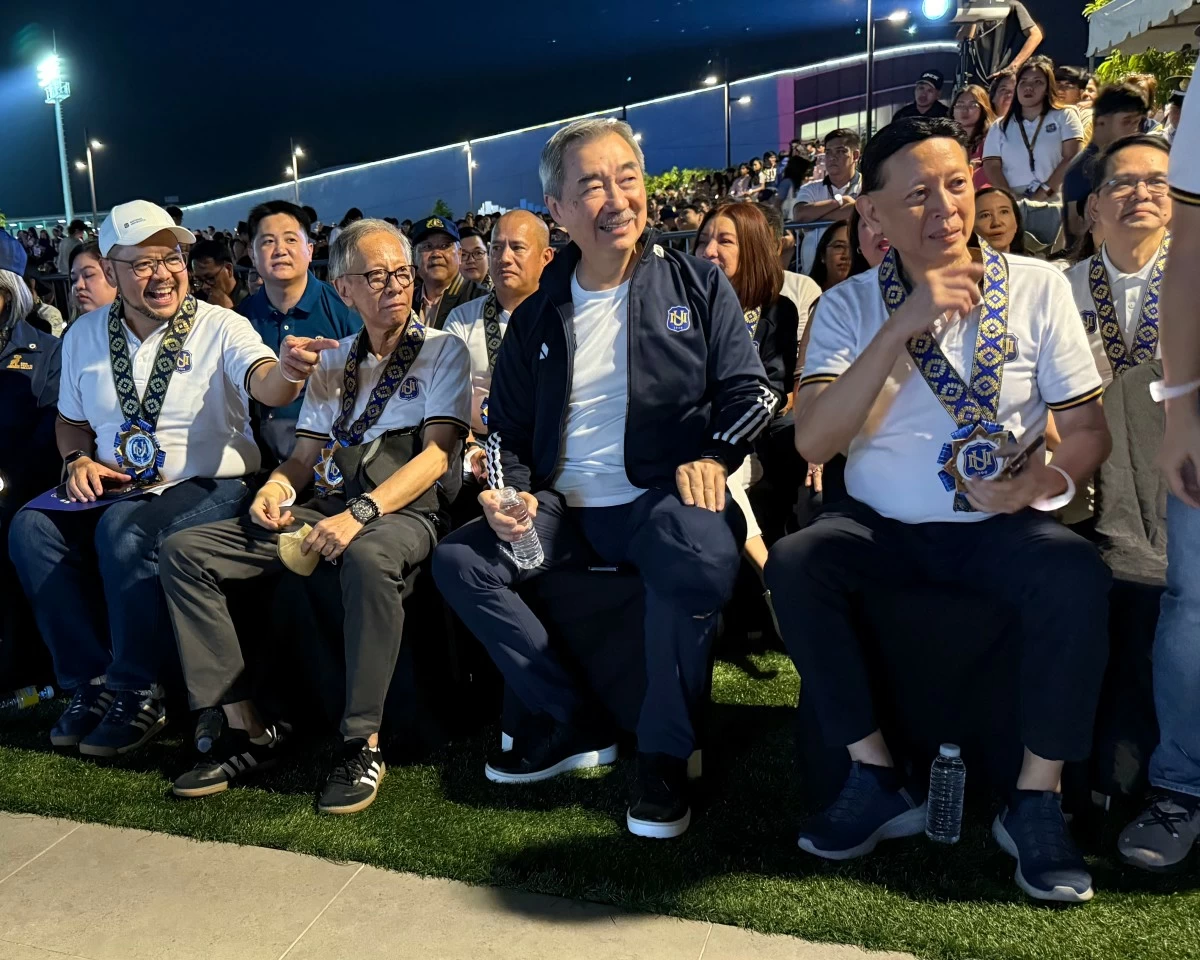 NU president Renato H. Ermita (far left), and NU chairman Hans Sy (second from the right), greeting the newcomers