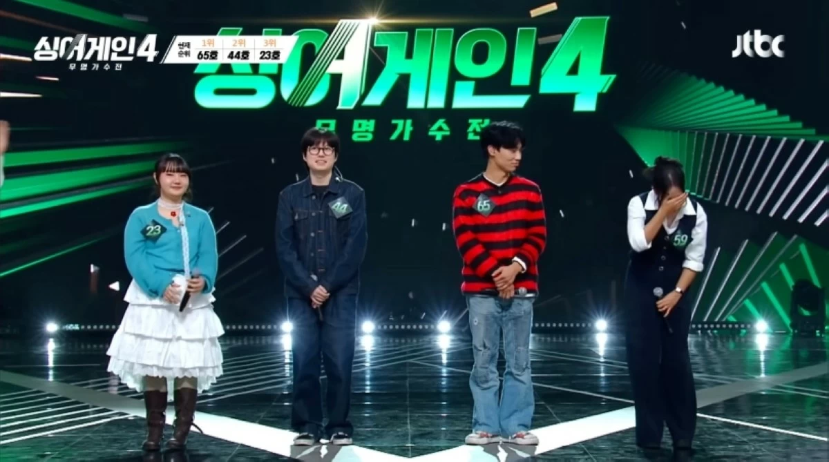 Gwyn Dorado (extreme right) reacts after getting the votes from all the judges (Screenshot from JTBC Music video on YouTube) 
