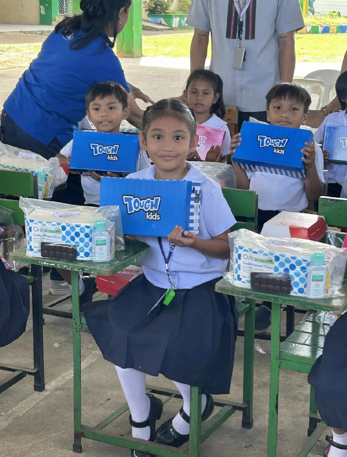 Happy faces of children with brand new shoes for the holiday season.