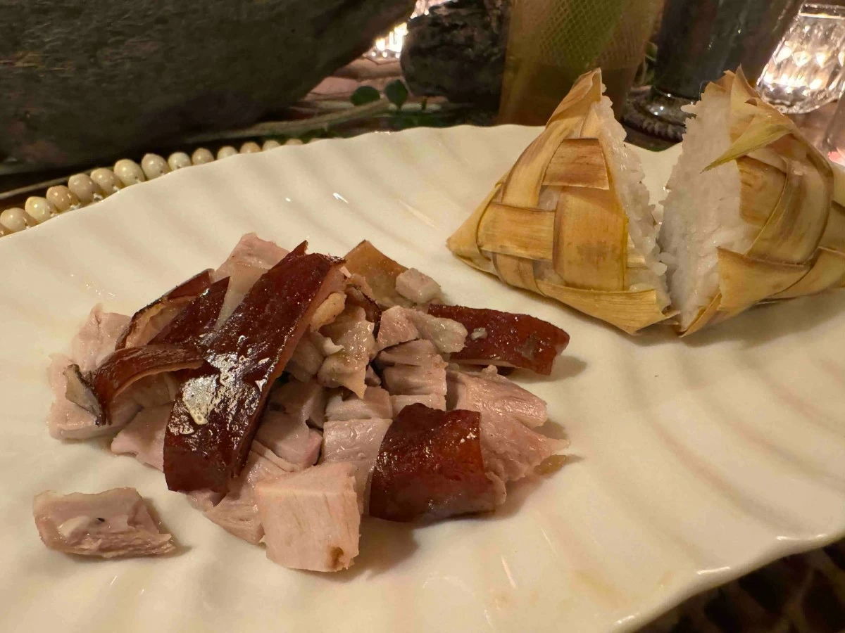 ROOTED FEAST Lechong baboy ramo served with puso and tuslob buwa at Tiya’s House, a dish that brings regional flavors and communal tradition to the center of the table