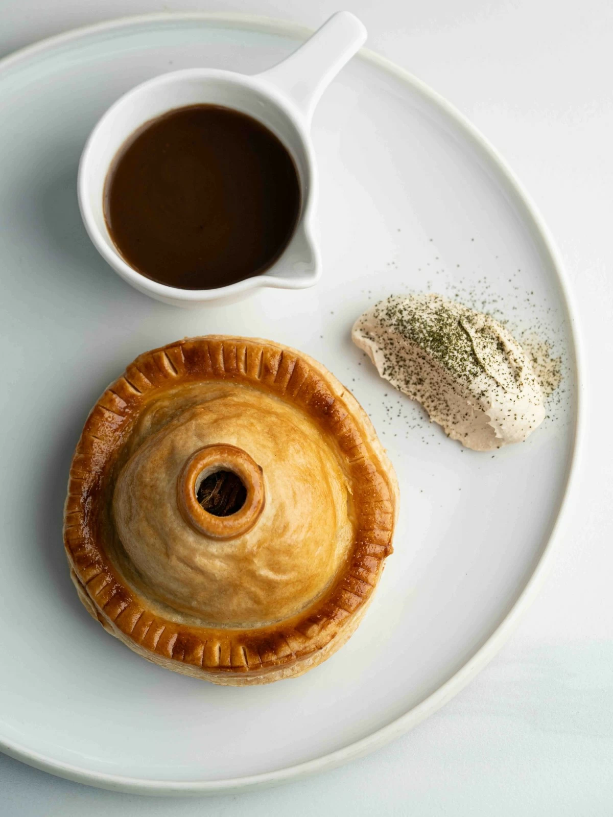PARES REIMAGINED The Pares Pithivier transforms the beloved beef pares into a refined, golden pastry, blending comfort and technique in the Offbeat Bistro x Rebel Bakehouse collaboration