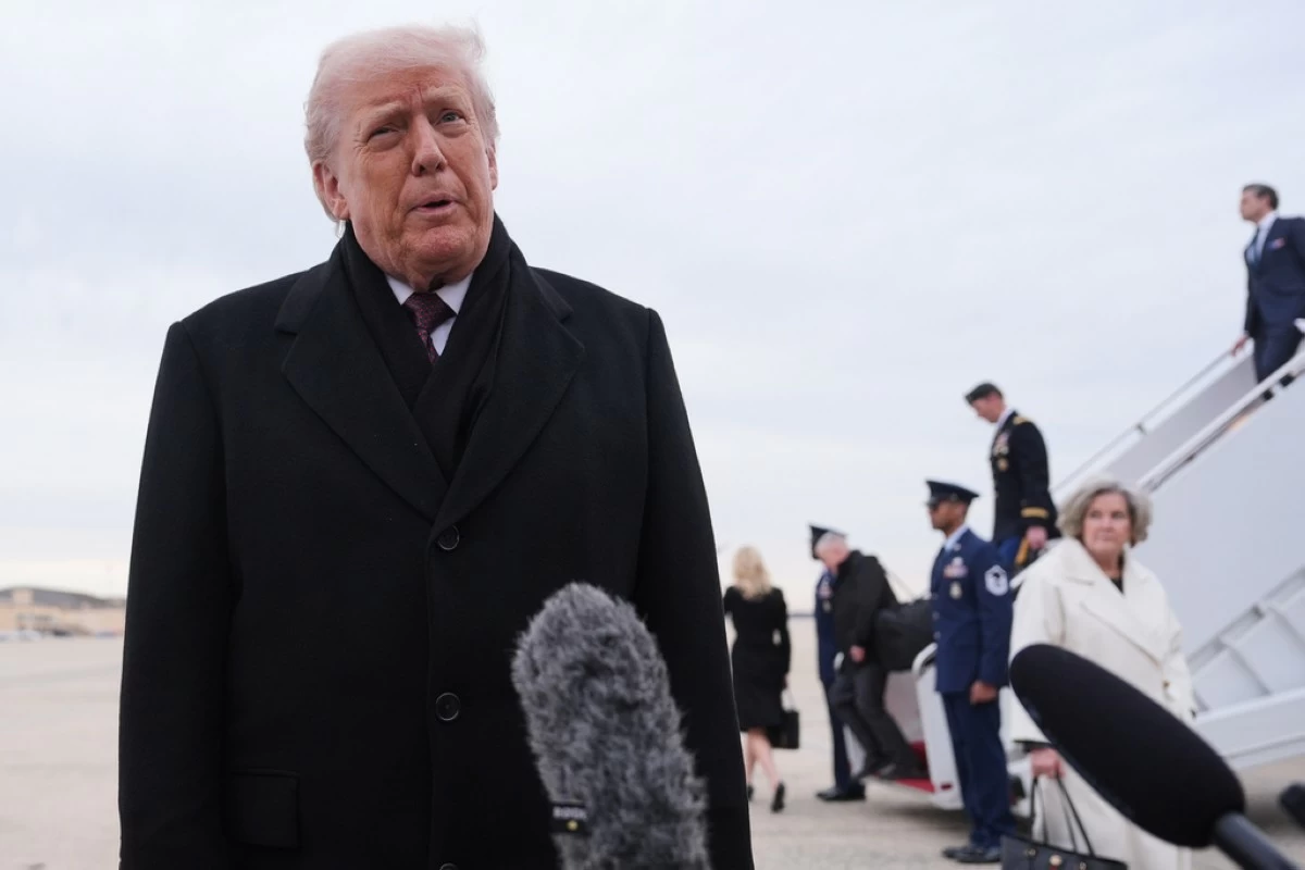 President Donald Trump talks to reporters after arriving on Air Force One, Wednesday, Dec. 17, 2025, at Joint Base Andrews, Md., after attending a casualty return at Dover Air Foce Base. (AP Photo/Evan Vucci)