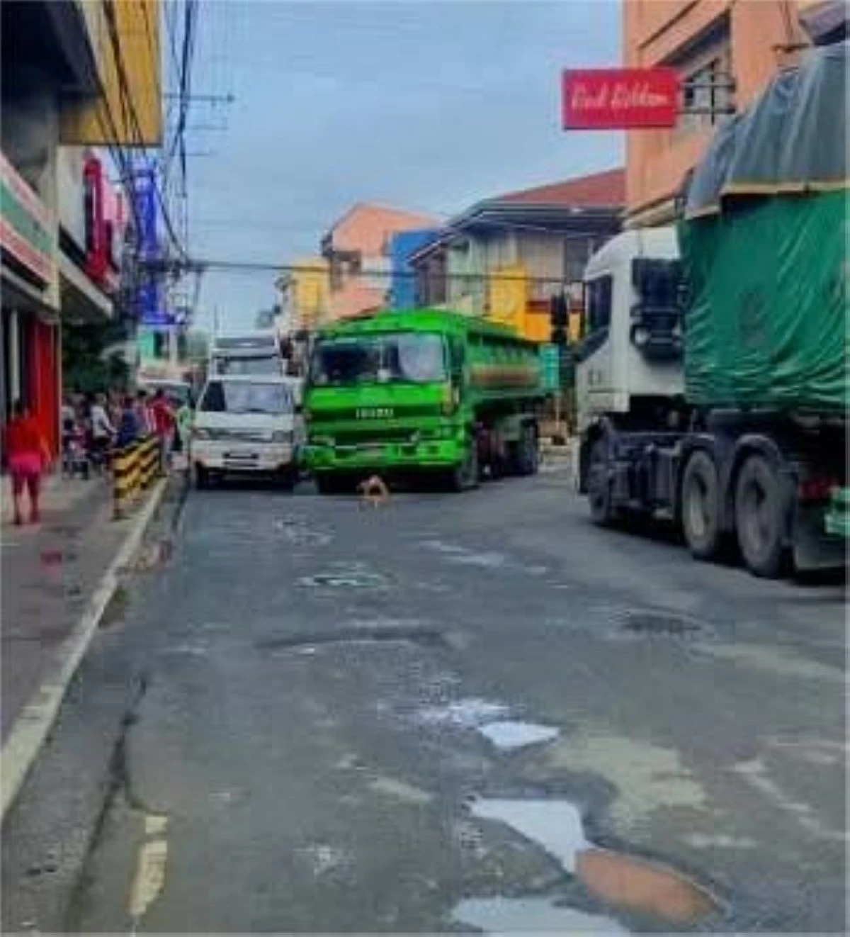 THIS major intersection in Gumaca, Quezon is dotted with potholes like the Moon and people have appealed for its immediate repair.   