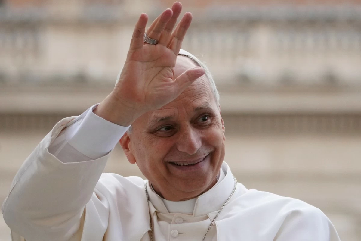 Pope Leo XIV waves as he leaves after his weekly general audience in St. Peter's Square at The Vatican, Wednesday, Dec.17, 2025. (AP Photo/Alessandra Tarantino)