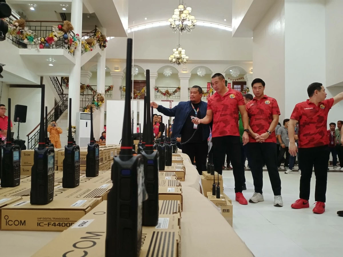 San Juan City Mayor Francis Zamora inspects the newly-purchased radios to be distributed to the city's offices and rescue teams on Friday, Dec. 19. (Photo by Patrick Garcia)