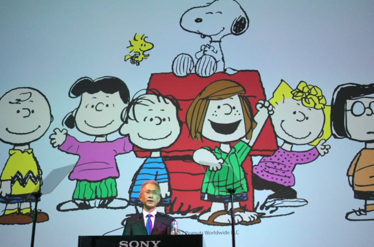 Sony Corp. President Kenichiro Yoshida speaks as characters from Peanuts are shown at a press conference at the company’s headquarters Tuesday, May 22, 2018, in Tokyo. (AP Photo/Eugene Hoshiko, File)

