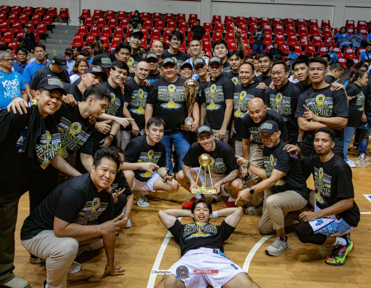 Abra Solid North Weavers owner Rep. JB Bernos holds the MPBL National Championship trophy as he celebrates with his team after completing a three-game sweep of the Quezon Huskers.

 