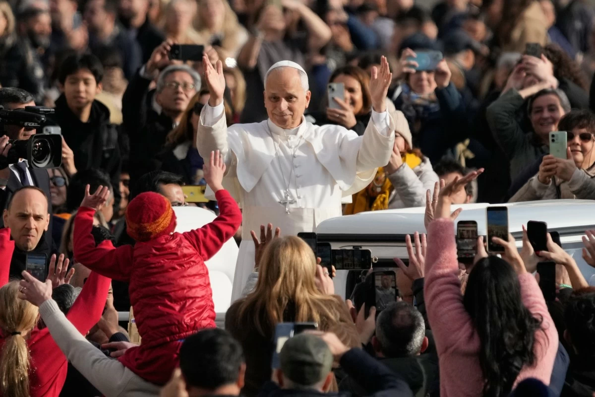 Pope Leo XIV waves to faithful as he arrives in St. Peter's Square on the occasion of the last Jubilee audience, at the Vatican, Saturday, Dec. 20, 2025. (AP Photo/Gregorio Borgia)