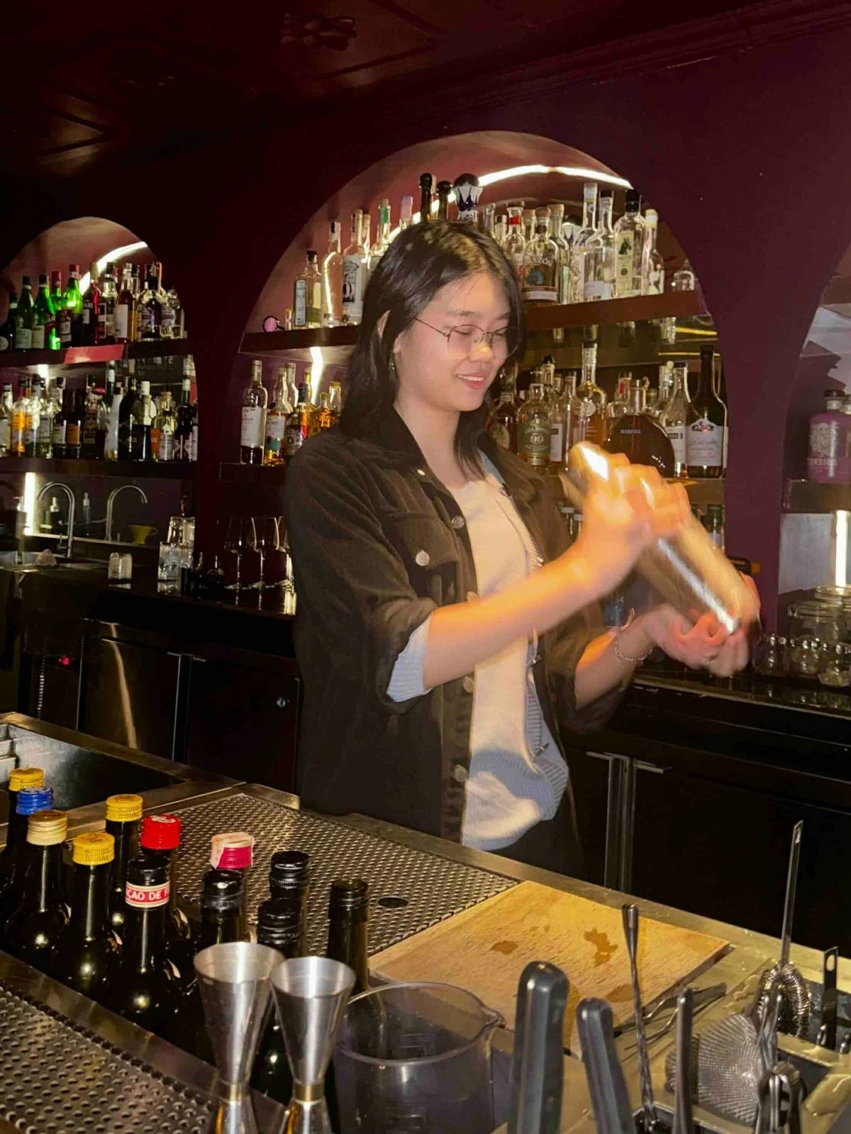 FESTIVE SIP Joana Paguio, a Benilde Hospitality Management graduate and bartender at Cheshire Speakeasy, reimagines puto bumbong as a Christmas cocktail inspired by familiar holiday aromas and flavors.