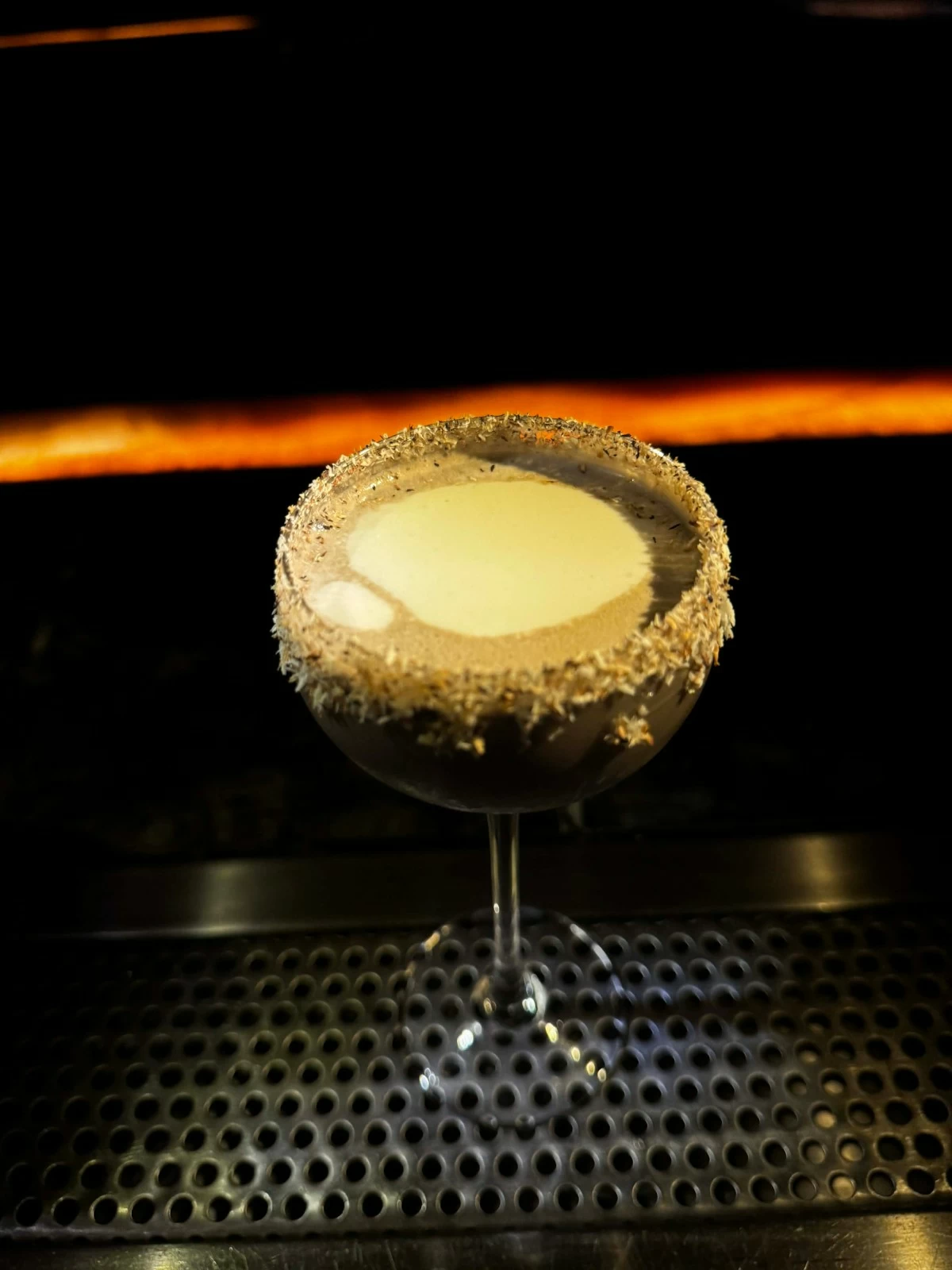 HOLIDAY POUR A puto bumbong-inspired Christmas cocktail by Joana Paguio, blending rum, homemade ube cream and muscovado syrup, finished with a coconut rim.