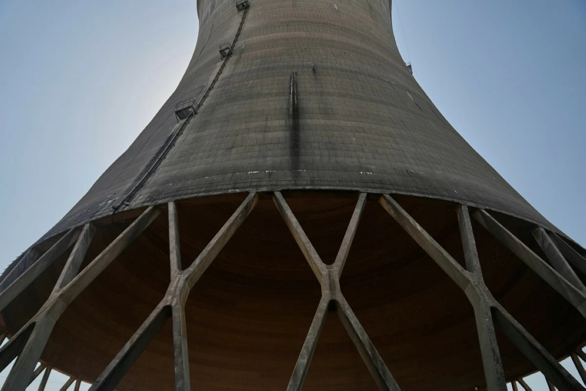 FILE - The base of a cooling tower at Constellation's nuclear power plant stands on Three Mile Island near Middletown, Pa., June 25, 2025. (AP Photo/Stephanie Scarbrough, File)