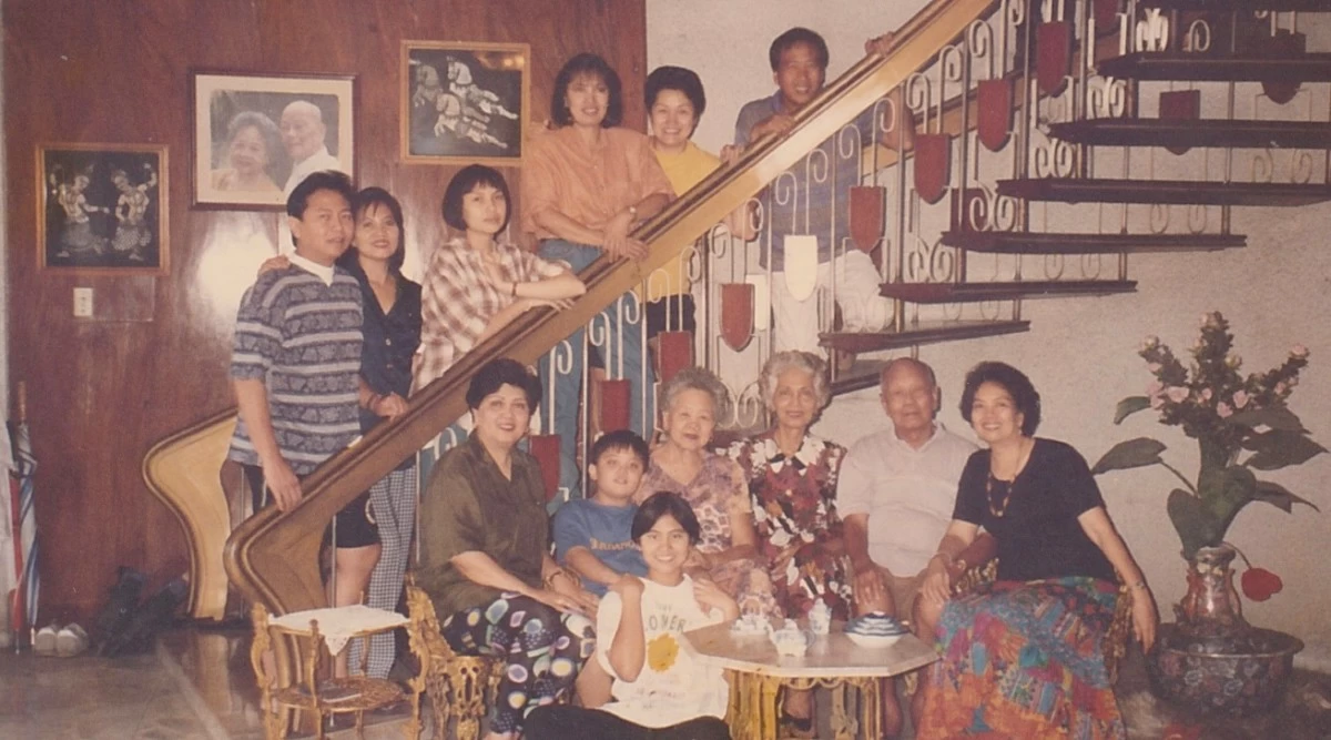 FULL HOUSE The author at the grand staircase of their Malabon home with aunts, uncles, paternal grandparents, parents, cousins, and his sister.