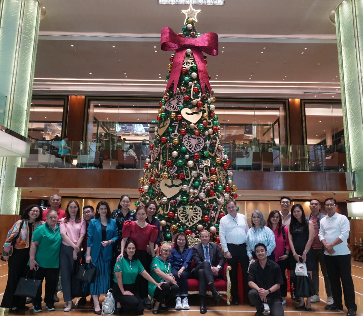 Ambassador Christian Halaas Lyster (seated, right) with his 'secret power'—the dedicated embassy staff who make his diplomatic work efficient, seamless, and successful.