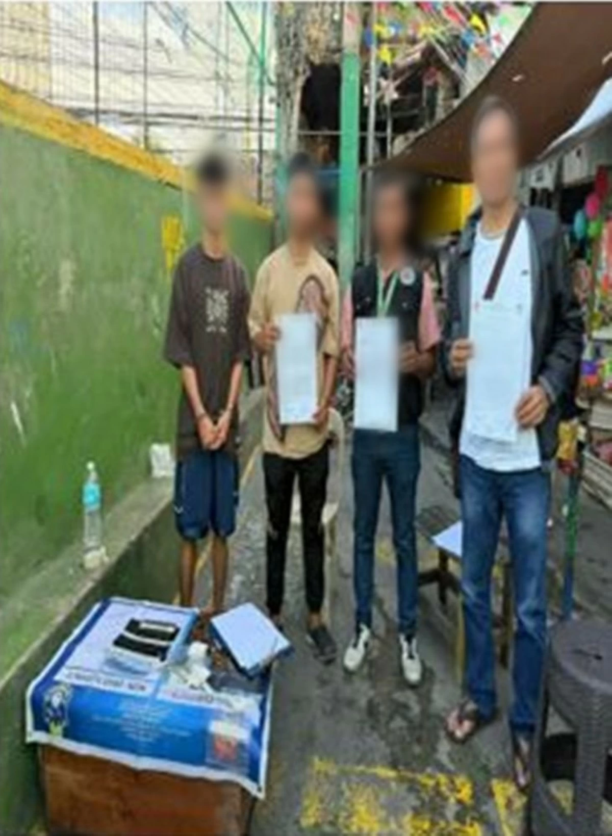 The arrested suspect in black t-shirt and shorts. (Photo from SPD)