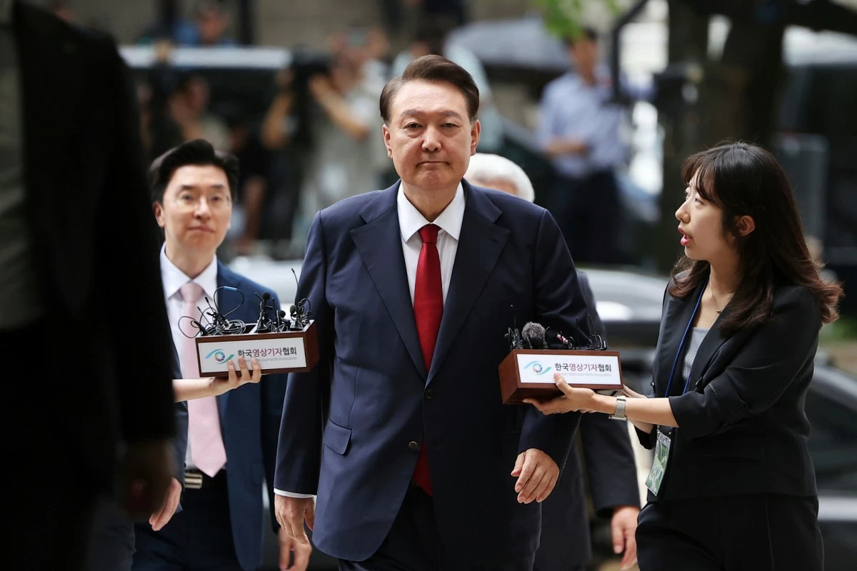 FILE - Former South Korean President Yoon Suk Yeol, center, arrives at a court to attend a hearing to review his arrest warrant requested by special prosecutors in Seoul, South Korea, on July 9, 2025. (Kim Hong-Ji/Pool Photo via AP, File)